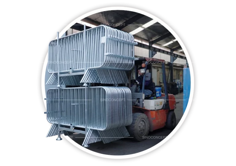 Crowd barrier stillage loaded with stacked crowd barriers, shown on a forklift for warehouse handling and transport