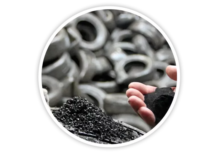 Hand holding recycled rubber granules made from old tyres used in manufacturing eco-friendly road safety equipment