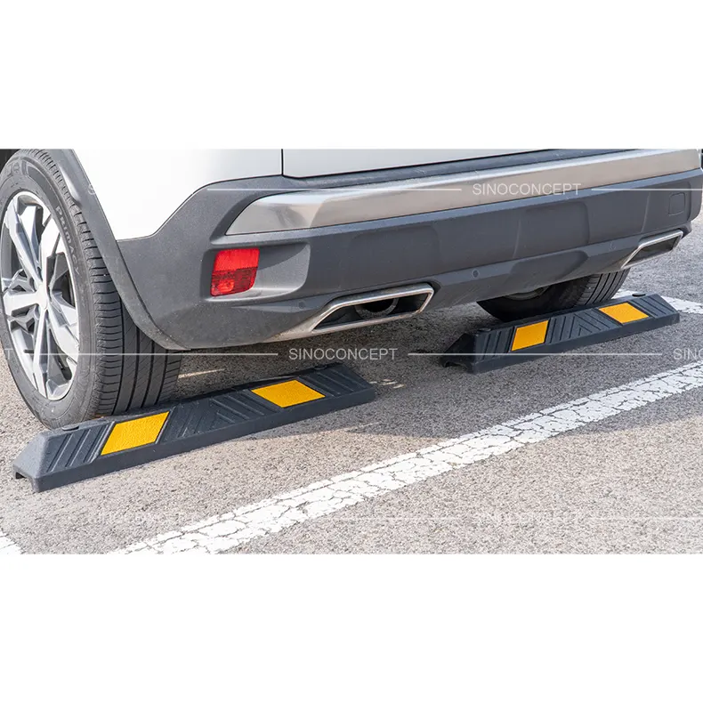 900 mm plastic-rubber composite wheel stop positioned under a car, featuring yellow reflective films