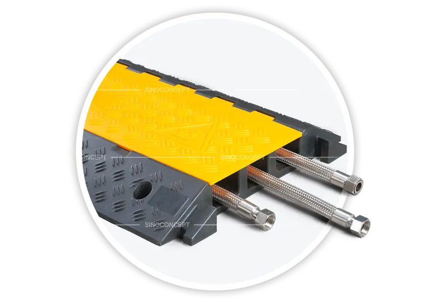 Close-up of 3-channel cable ramp with cables entering the channel under yellow lid
