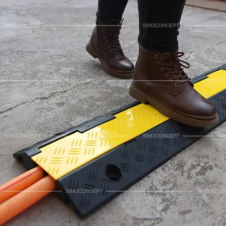 Cable ramps and cable protectors used in pedestrian walkway area