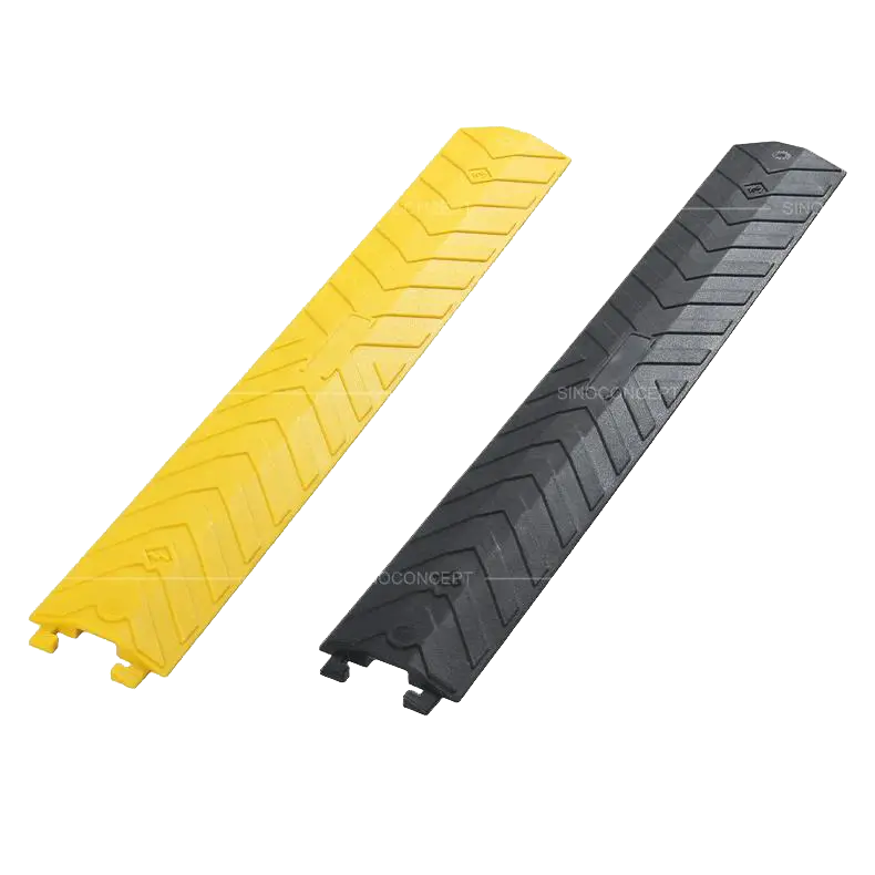Small drop over cable cover in yellow and black with textured surface for road safety and cable protection