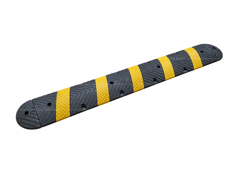 Black and yellow one-part speed bump with anti-slip pattern and bolt fixing holes