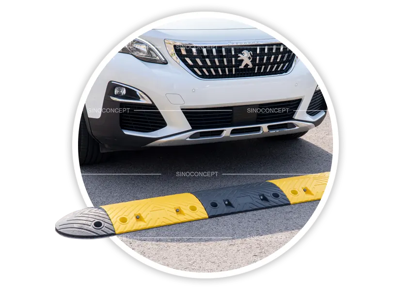 Speed humps installed for traffic calming at a car park entrance to slow vehicles