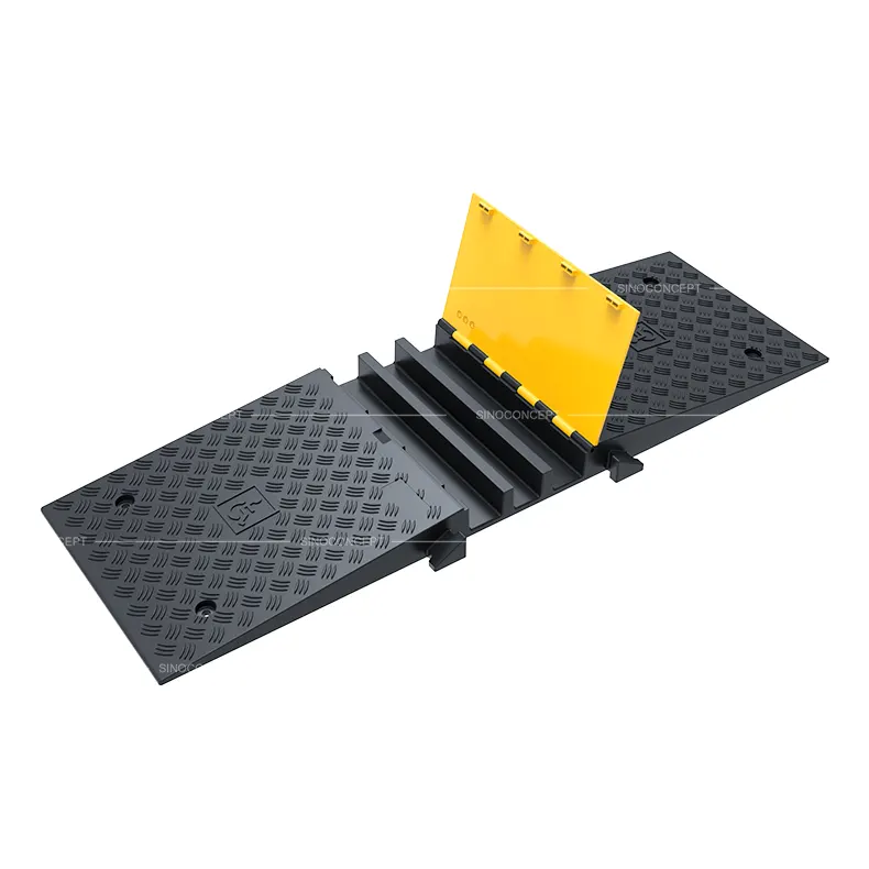 Close-up of 3-channel DDA wheelchair cable ramp showing hinged yellow lid and cable channels