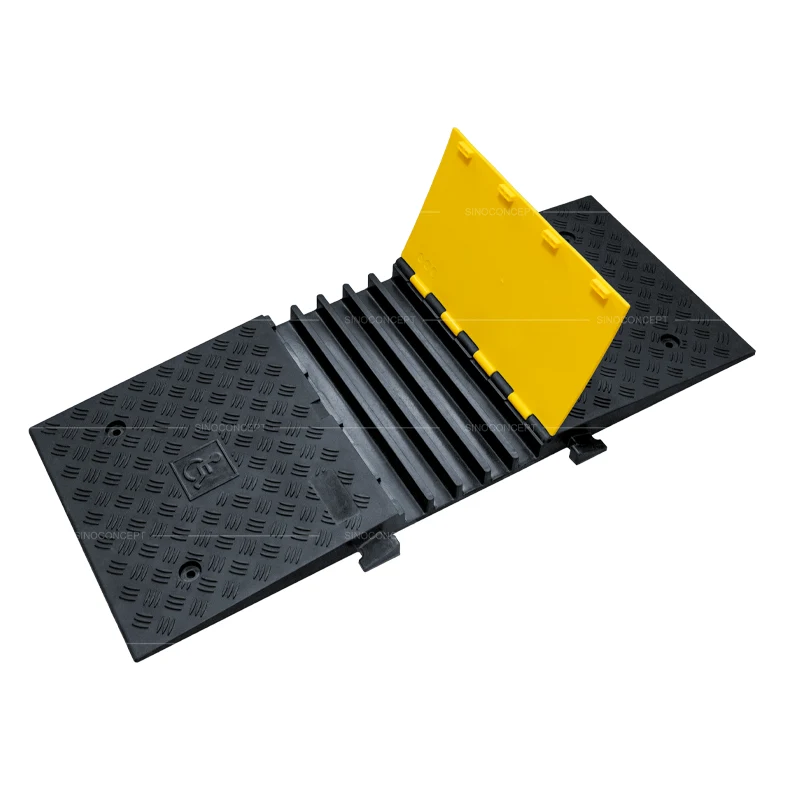 5-channel DDA wheelchair cable ramp with hinged yellow lid showing internal cable channels for easy cable installation
