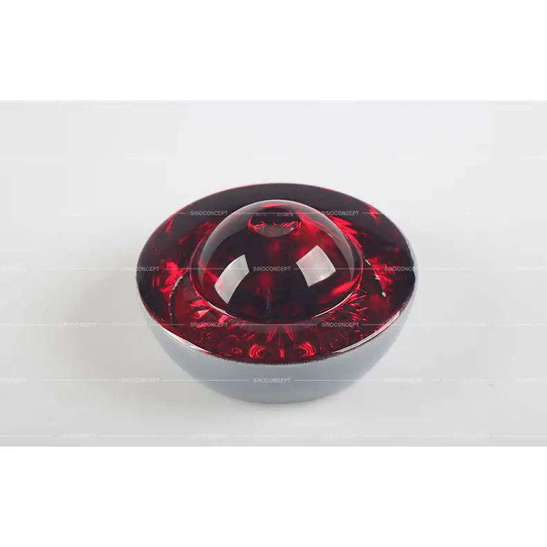 Large glass road stud in red for warning zones and no-entry road markings