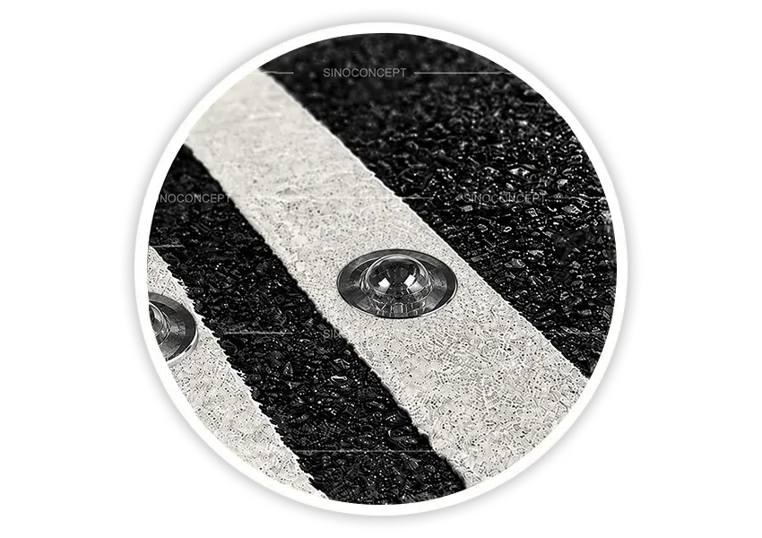 Glass road stud from the reflective road studs range installed in a white road line for lane marking