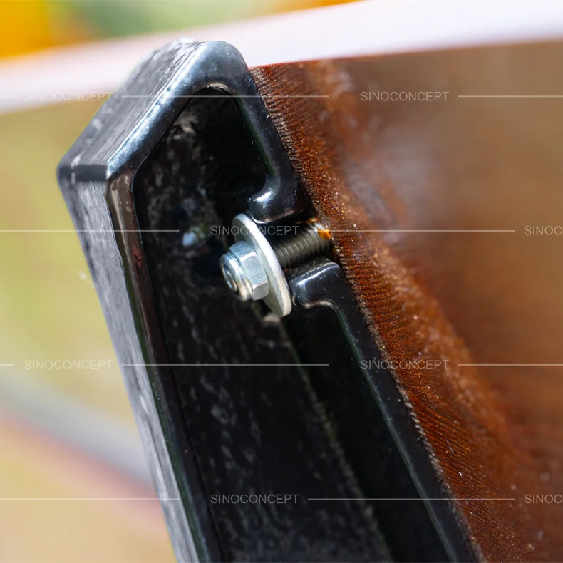 Close-up of 5-slat street bench showing bolted connection between pine wood slat and cast iron leg