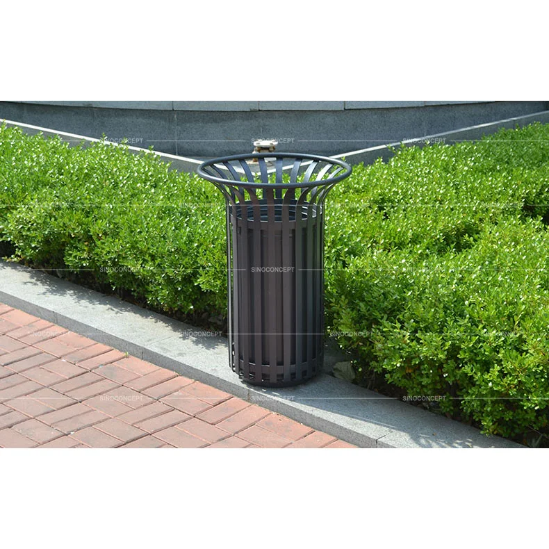 50 L Tulip Litter Bin installed beside a pavement and planted area in an outdoor public space