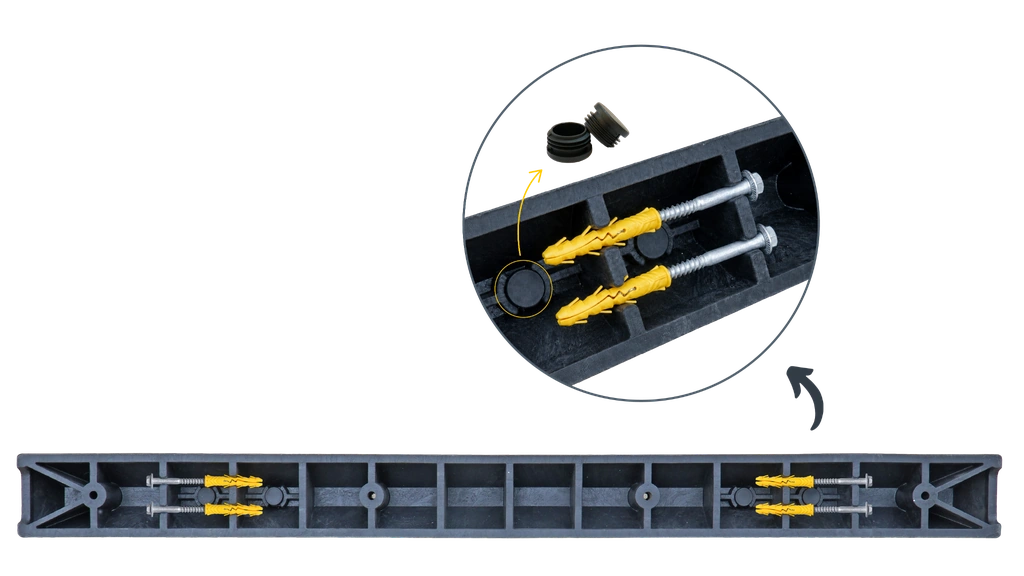 Underside of a wheel stop showing coach screws, plastic anchors and plastic caps stored beneath the product.