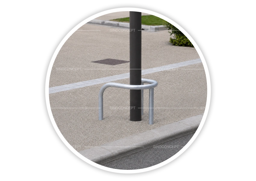 Low-level hoop barriers and lamp post protectors installed around post in pedestrian area