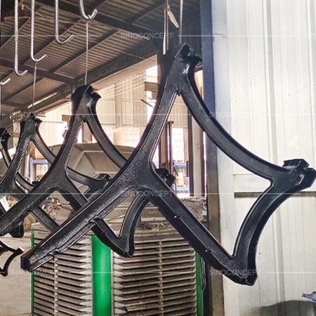 Outdoor benches and seating cast iron legs during UV-resistant powder coating process in factory