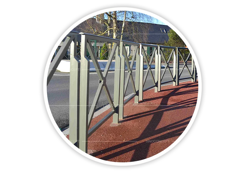 Green pedestrian guardrails installed along roadside to guide pedestrian movement and separate vehicles