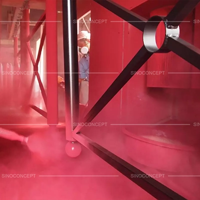 Worker spray coating pedestrian guardrails with UV-resistant powder coating for outdoor colour stability