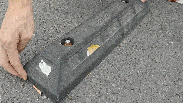 Wheel stop fixing hardware with screws and anchors for secure installation