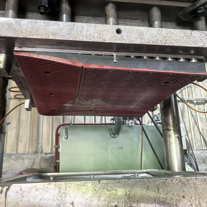 Rubber product compression moulding process using an industrial press during production