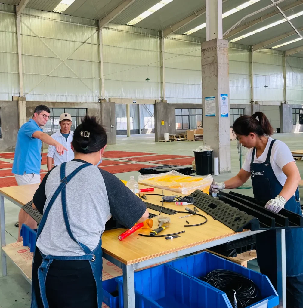 Sino Concept production assembly process showing workers assembling and checking rubber safety products