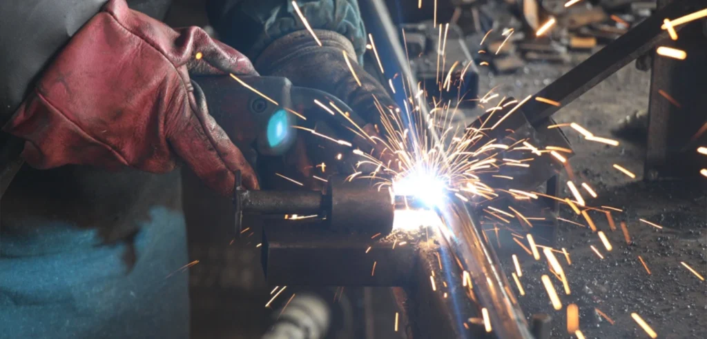 Steel fabrication and surface treatment process showing welding and finishing of metal products