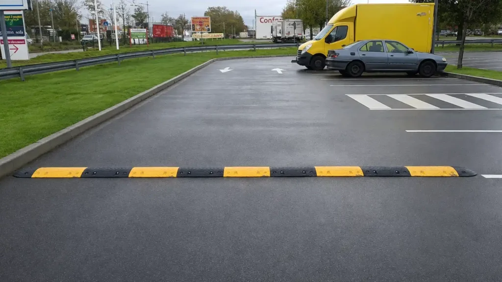 Speed bump installed across a parking area for vehicle control